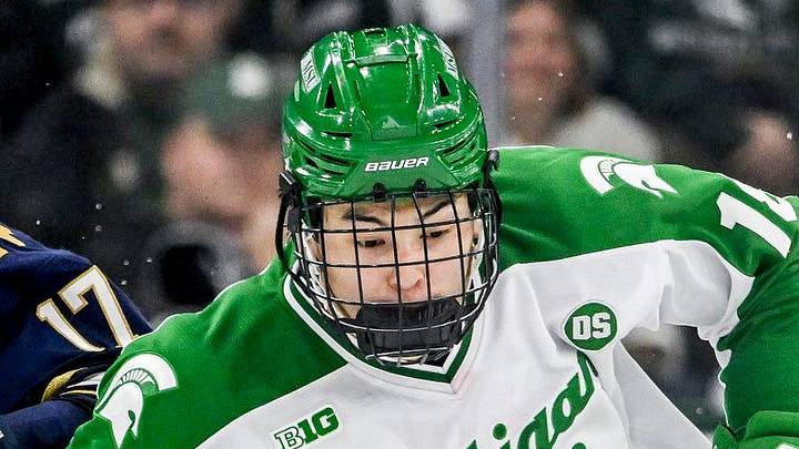 Michigan State's Ryker Lee, right, moves the puck against Notre Dame's Pano Fimis during the third period on Thursday, Feb. 19, 2026, at the Munn Ice Arena in East Lansing.