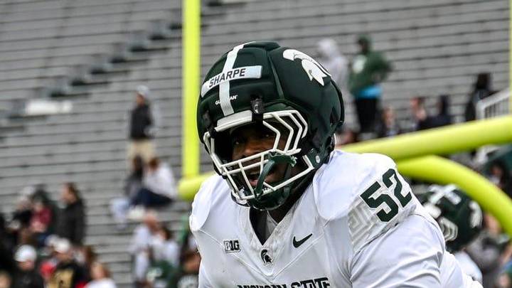 Michigan State's Nick Sharpe, center, runs a drill during the football Spring Showcase on Saturday, April 18, 2026, at Spartan Stadium in East Lansing.