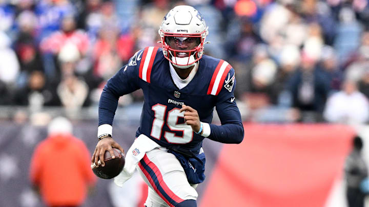Jan 5, 2025; Foxborough, Massachusetts, USA; New England Patriots quarterback Joe Milton III (19) runs against the Buffalo Bills during the first half at Gillette Stadium. Mandatory Credit: Brian Fluharty-Imagn Images