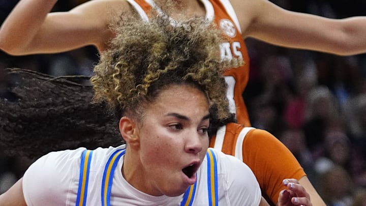 UCLA guard Kiki Rice (1) drives against Texas at Mortgage Matchup Center during a Final Four semifinal game in Phoenix on April 3, 2026. UCLA guard Kiki Rice (1) drives against Texas at Mortgage Matchup Center during a Final Four semifinal game in Phoenix on April 3, 2026.