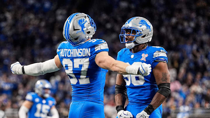 Detroit Lions defensive end Aidan Hutchinson (97) celebrates a sack against Pittsburgh Steelers with linebacker Al-Quadin Muhammad (96) during the first half at Ford Field in Detroit on Sunday, Dec. 21, 2025. Detroit Lions defensive end Aidan Hutchinson (97) celebrates a sack against Pittsburgh Steelers with linebacker Al-Quadin Muhammad (96) during the first half at Ford Field in Detroit on Sunday, Dec. 21, 2025.