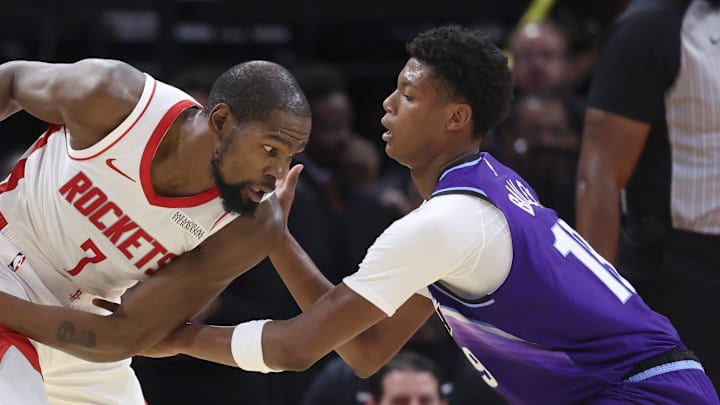 Oct 8, 2025; Houston, Texas, USA; Houston Rockets forward Kevin Durant (7) controls the ball as Utah Jazz forward Ace Bailey (19) defends during the second quarter at Toyota Center. Mandatory Credit: Troy Taormina-Imagn Images