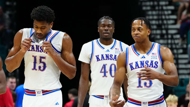 Nov 24, 2025; Las Vegas, Nevada, USA; Kansas Jayhawks guard Melvin Council Jr. (14), forward Bryson Tiller (15), forward Flory Bidunga (40), guard Elmarko Jackson (13) and guard Tre White (3) walk back onto the court after a timeout against the Notre Dame Fighting Irish during the first half in a 2025 Players Era Festival group play game at MGM Grand Garden Arena. Mandatory Credit: Stephen R. Sylvanie-Imagn Images