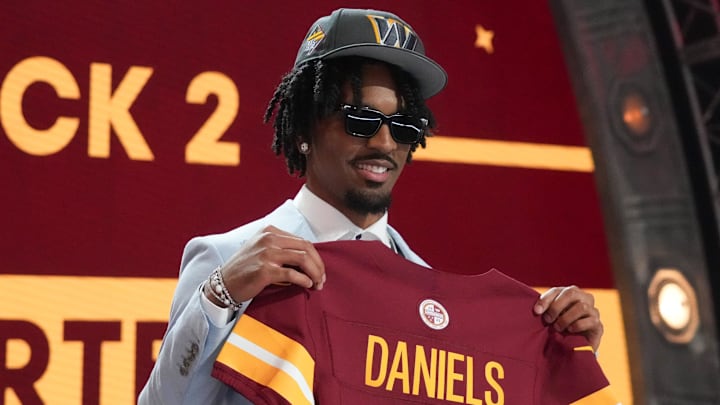 Jayden Daniels poses after being selected by the Washington Commanders Mandatory Credit: Kirby Lee-Imagn Images Jayden Daniels poses after being selected by the Washington Commanders Mandatory Credit: Kirby Lee-Imagn Images