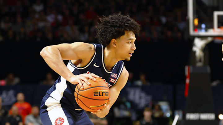 Jan 17, 2026; Orlando, Florida, USA;  Central Florida Knights guard Riley Kugel (2) defends Arizona Wildcats guard Brayden Burries (5) in the second half at Addition Financial Arena. Mandatory Credit: Russell Lansford-Imagn Images