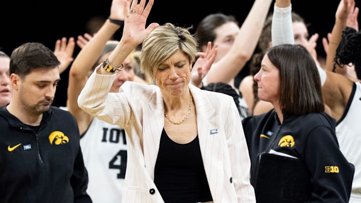 The Iowa Hawkeyes women’s basketball team and staff wave to fans as they walk off the court following a double overtime loss to against the Virginia Cavaliers March 23, 2026 during a Round of 32 NCAA March Madness game at Carver-Hawkeye Arena in Iowa City, Iowa.