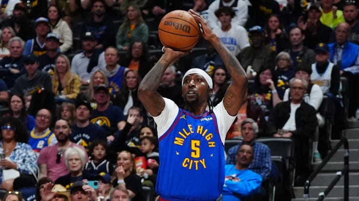 May 4, 2024; Denver, Colorado, USA; Denver Nuggets guard Kentavious Caldwell-Pope (5) shoots the ball in the second half against the Minnesota Timberwolves during game one of the second round for the 2024 NBA playoffs at Ball Arena. Mandatory Credit: Ron Chenoy-USA TODAY Sports