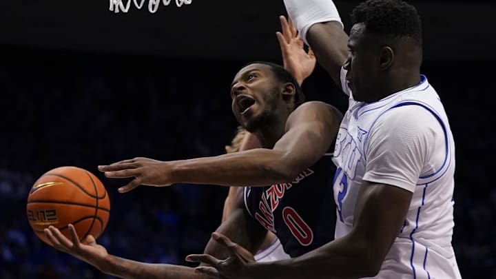Jan 26, 2026; Provo, Utah, USA; Arizona Wildcats guard Jaden Bradley (0) drives to the basket while being defended by BYU Cougars forward Keba Keita (13) during the second half at Marriott Center. Mandatory Credit: Aaron Baker-Imagn Images Jan 26, 2026; Provo, Utah, USA; Arizona Wildcats guard Jaden Bradley (0) drives to the basket while being defended by BYU Cougars forward Keba Keita (13) during the second half at Marriott Center. Mandatory Credit: Aaron Baker-Imagn Images