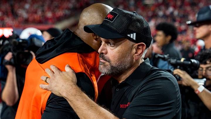 Head coaches Matt Rhule of Nebraska and Eddie George of Bowling Green embrace after the game. Head coaches Matt Rhule of Nebraska and Eddie George of Bowling Green embrace after the game.