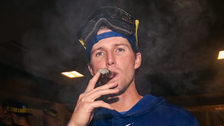Kansas City Royals starting pitcher Kyle Wright (30) celebrates after clinching a wild card playoff birth 