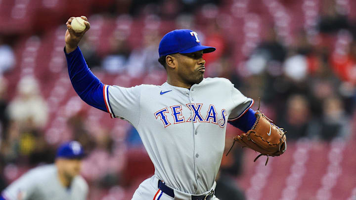 Mar 31, 2025; Cincinnati, Ohio, USA; Texas Rangers starting pitcher Kumar Rocker (80) pitches against the Cincinnati Reds in the first inning at Great American Ball Park. 