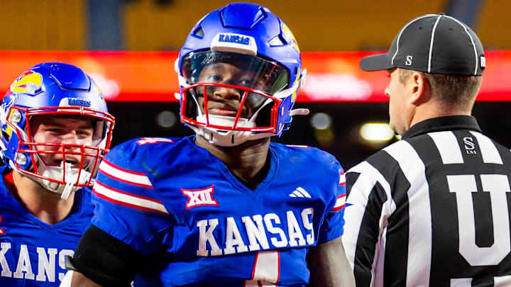 Nov 23, 2024; Kansas City, Missouri, USA;  Kansas running back Devin Neal (4) reacts after scoring a touchdown during the 3rd quarter between the Kansas Jayhawks and the Colorado Buffaloes at GEHA Field at Arrowhead Stadium. Mandatory Credit: Nick Tre. Smith-Imagn Images