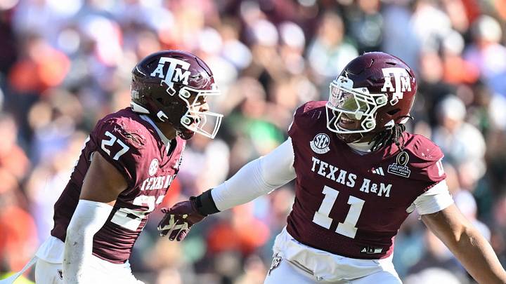 Texas A&M Aggies linebacker Daymion Sanford (27) reacts with defensive tackle Tyler Onyedim (11) after recovering a fumble against the Miami Hurricanes during the second half of the first round game of the CFP National Playoff at Kyle Field. Texas A&M Aggies linebacker Daymion Sanford (27) reacts with defensive tackle Tyler Onyedim (11) after recovering a fumble against the Miami Hurricanes during the second half of the first round game of the CFP National Playoff at Kyle Field.