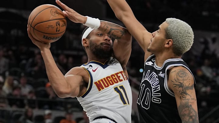 Nov 7, 2022; San Antonio, Texas, USA;  Denver Nuggets forward Bruce Brown (11) looks to pass against San Antonio Spurs forward Jeremy Sochan (10) in the second half at the AT&T Center.