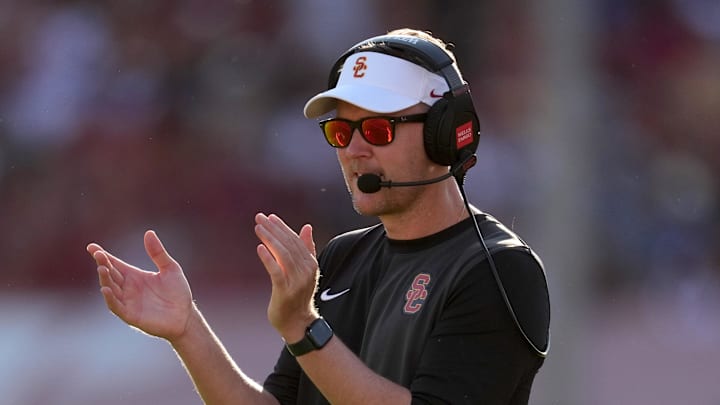 Aug 30, 2025; Los Angeles, California, USA; Southern California Trojans head coach Lincoln Riley watches from the sidelines against the Missouri State Bears in the first half at United Airlines Field at Los Angeles Memorial Coliseum. 
