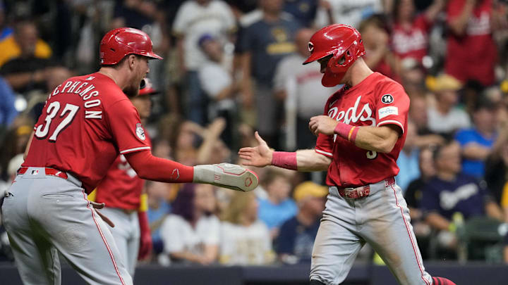 Sep 27, 2025; Milwaukee, Wisconsin, USA; Cincinnati Reds catcher Tyler Stephenson (37) greets second baseman Matt McLain (9) after scoring during the third inning against the Milwaukee Brewers at American Family Field. Mandatory Credit: Jeff Hanisch-Imagn Images Sep 27, 2025; Milwaukee, Wisconsin, USA; Cincinnati Reds catcher Tyler Stephenson (37) greets second baseman Matt McLain (9) after scoring during the third inning against the Milwaukee Brewers at American Family Field. Mandatory Credit: Jeff Hanisch-Imagn Images