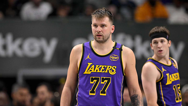 Apr 9, 2025; Dallas, Texas, USA; Los Angeles Lakers guard Luka Doncic (77) and guard Austin Reaves (15) during the game between the Dallas Mavericks and the Los Angeles Lakers at American Airlines Center. Mandatory Credit: Jerome Miron-Imagn Images