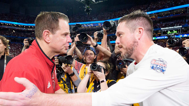 Oregon head coach Dan Lanning, right, and Indiana head coach Curt Cignetti shake hands as the Oregon Ducks face the Indiana Hoosiers in the Peach Bowl on Jan. 9, 2026, at Mercedes-Benz Stadium in Atlanta, Georgia.