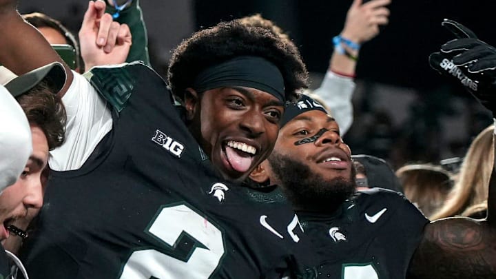 Michigan State's Aidan Chiles, center, and Marcellius Pulliam, right, celebrate with fans in the student section after MSU's win over Boston College on Saturday, Sept. 6, 2025, at Spartan Stadium in East Lansing. Michigan State's Aidan Chiles, center, and Marcellius Pulliam, right, celebrate with fans in the student section after MSU's win over Boston College on Saturday, Sept. 6, 2025, at Spartan Stadium in East Lansing.