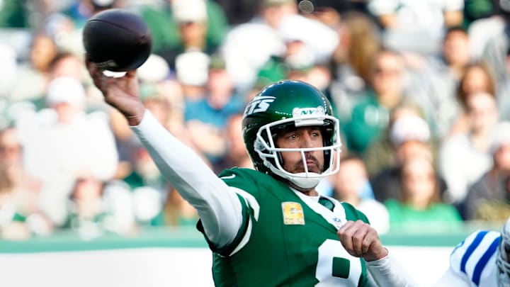 New York Jets quarterback Aaron Rodgers throws a pass. New York Jets quarterback Aaron Rodgers throws a pass.