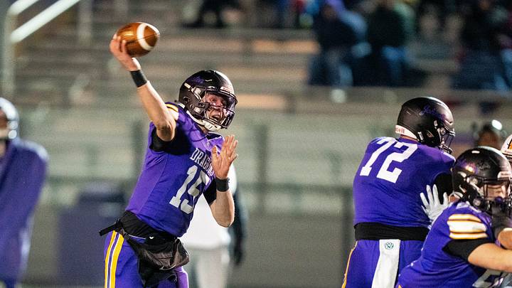 Johnston's Trevin Helming (15) throws the ball to a receiver downfield on Nov. 7, 2025, at Johnston High School. Johnston's Trevin Helming (15) throws the ball to a receiver downfield on Nov. 7, 2025, at Johnston High School.