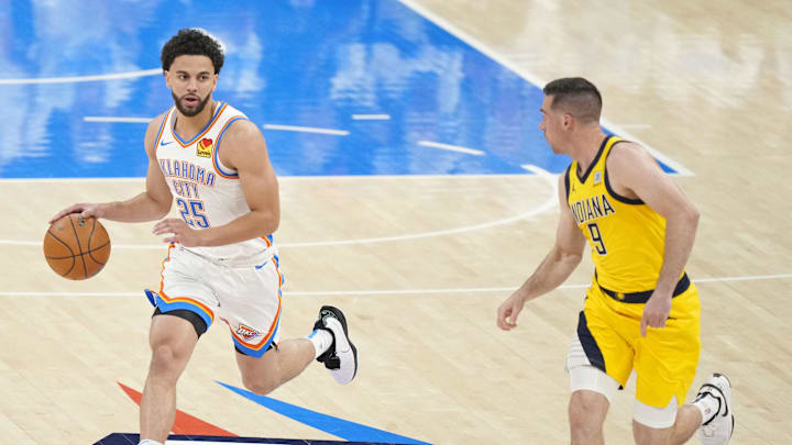 Jun 5, 2025; Oklahoma City, Oklahoma, USA; Oklahoma City Thunder guard Ajay Mitchell (25) dribbles the ball against Indiana Pacers guard T.J. McConnell (9) during the first quarter in game one of the 2025 NBA Finals at Paycom Center. Mandatory Credit: Kyle Terada-Imagn Images Jun 5, 2025; Oklahoma City, Oklahoma, USA; Oklahoma City Thunder guard Ajay Mitchell (25) dribbles the ball against Indiana Pacers guard T.J. McConnell (9) during the first quarter in game one of the 2025 NBA Finals at Paycom Center. Mandatory Credit: Kyle Terada-Imagn Images