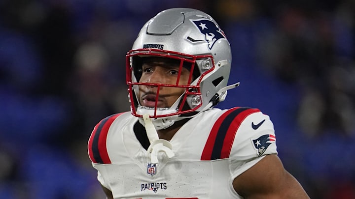 Dec 21, 2025; Baltimore, Maryland, USA;  New England Patriots running back Treveyon Henderson (32) warms up prior to the game against the Baltimore Ravens at M&T Bank Stadium. Mandatory Credit: James Lang-Imagn Images