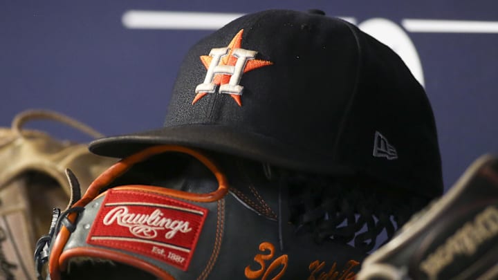 A detailed view of the hat and glove of Houston Astros