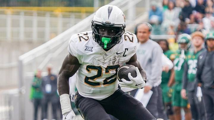 Nov 1, 2025; Waco, Texas, USA; UCF Knights running back Myles Montgomery (22) carries the ball against the Baylor Bears during the second half at McLane Stadium. Mandatory Credit: Raymond Carlin III-Imagn Images Nov 1, 2025; Waco, Texas, USA; UCF Knights running back Myles Montgomery (22) carries the ball against the Baylor Bears during the second half at McLane Stadium. Mandatory Credit: Raymond Carlin III-Imagn Images