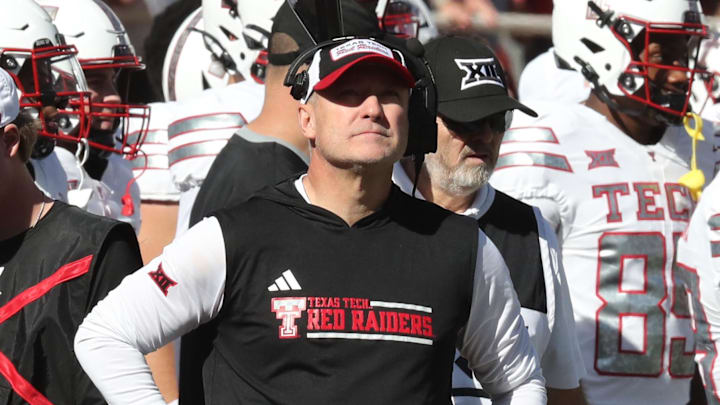 Nov 8, 2025; Lubbock, Texas, USA;  Texas Tech Red Raiders head coach Joey McGuire checks the score board in the second half of the game against the Brigham Young Cougars at Jones AT&T Stadium. 