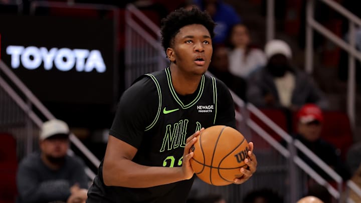 Jan 18, 2026; Houston, Texas, USA; New Orleans Pelicans center Derik Queen (22) shoots against the Houston Rockets during the third quarter at Toyota Center. Mandatory Credit: Erik Williams-Imagn Images