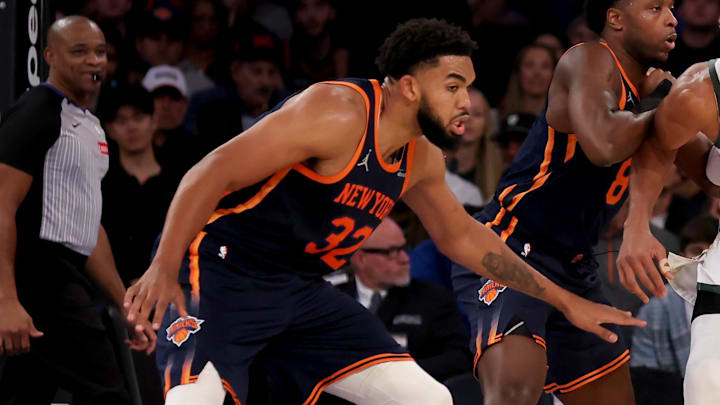 Nov 8, 2024; New York, New York, USA; Milwaukee Bucks forward Giannis Antetokounmpo (34) controls the ball against New York Knicks forward OG Anunoby (8) and center Karl-Anthony Towns (32) during the third quarter at Madison Square Garden. Mandatory Credit: Brad Penner-Imagn Images