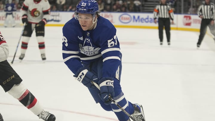 Sep 25, 2023; Toronto, Ontario, CAN; Toronto Maple Leafs forward Easton Cowan (53) skates with the puck against the Ottawa Senators during overtime at Scotiabank Arena. Mandatory Credit: John E. Sokolowski-Imagn Images