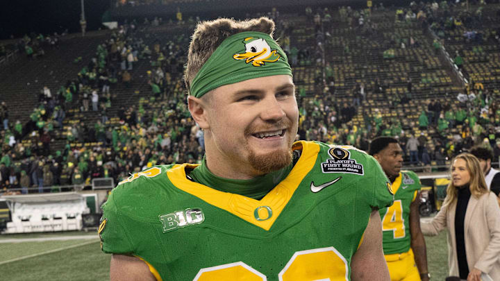 Oregon’s Bryce Boettcher celebrates the Ducks' victory over James Madison at the end of the game at Autzen Stadium in Eugene Dec. 20, 2025.