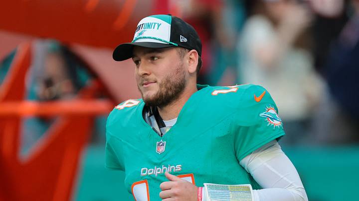Dec 28, 2025; Miami Gardens, Florida, USA;  Miami Dolphins quarterback Quinn Ewers (14) runs out for player introductions prior to a game against the Tampa Bay Buccaneers at Hard Rock Stadium. Mandatory Credit: Sam Navarro-Imagn Images