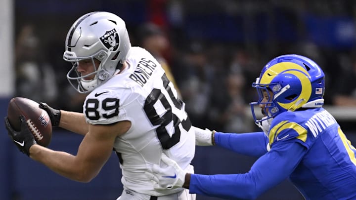 Oct 20, 2024; Inglewood, California, USA; Las Vegas Raiders tight end Brock Bowers (89) catches a pass against Los Angeles Rams cornerback Ahkello Witherspoon (4) in the first half at SoFi Stadium. Mandatory Credit: Alex Gallardo-Imagn Images