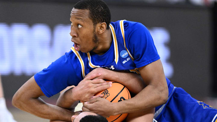 Mar 22, 2025; Providence, RI, USA; Purdue Boilermakers forward Trey Kaufman-Renn (4) and McNeese State Cowboys guard Quadir Copeland (11) fight for a loose ball during the second half of a second round men’s NCAA Tournament game at Amica Mutual Pavilion. Mandatory Credit: Brian Fluharty-Imagn Images Mar 22, 2025; Providence, RI, USA; Purdue Boilermakers forward Trey Kaufman-Renn (4) and McNeese State Cowboys guard Quadir Copeland (11) fight for a loose ball during the second half of a second round men’s NCAA Tournament game at Amica Mutual Pavilion. Mandatory Credit: Brian Fluharty-Imagn Images