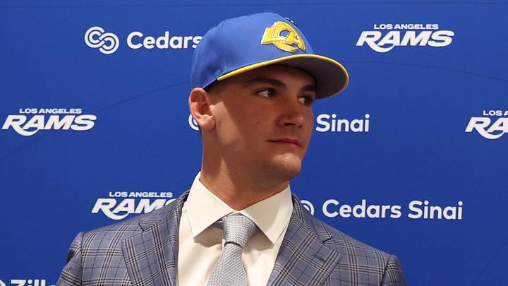 Los Angeles Rams quarterback Ty Simpson poses with his jersey.