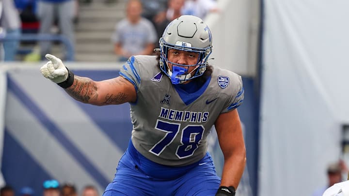 Oct 25, 2025; Memphis, Tennessee, USA; Memphis Tigers offensive lineman Travis Burke (78) gestures toward the South Florida Bulls defense on the line of scrimmage during the second half at Simmons Bank Liberty Stadium. Mandatory Credit: Wesley Hale-Imagn Images