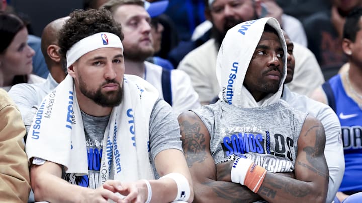 Mar 1, 2025; Dallas, Texas, USA;  Dallas Mavericks guard Kyrie Irving (right) and Dallas Mavericks guard Klay Thompson (31) react on the bench against the Milwaukee Bucks during the second half at American Airlines Center. Mandatory Credit: Kevin Jairaj-Imagn Images