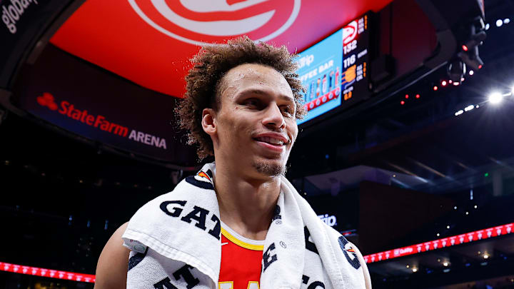 Dyson Daniels smiles as he walks off the court Dyson Daniels smiles as he walks off the court