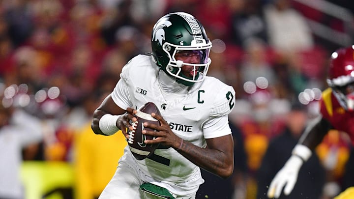 Sep 20, 2025; Los Angeles, California, USA; Michigan State Spartans quarterback Aidan Chiles (2) moves out to pass against the Southern California Trojans during the first half at the Los Angeles Memorial Coliseum.
