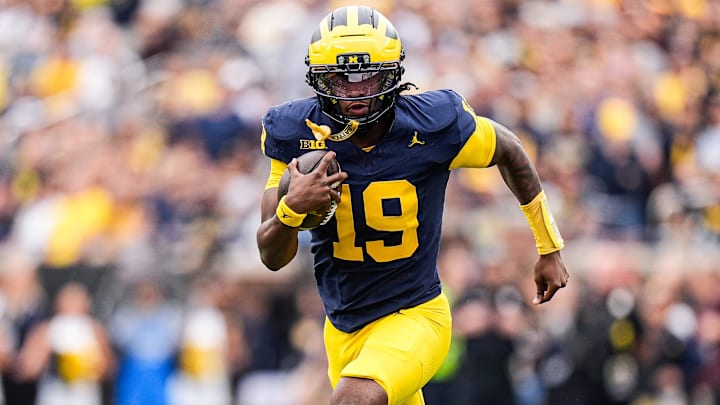 Michigan quarterback Bryce Underwood runs the ball against Central Michigan.