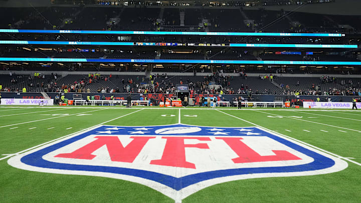 Oct 13, 2024; London, United Kingdom; The NFL shield logo at midfield during an NFL International Series game at Tottenham Hotspur Stadium. Oct 13, 2024; London, United Kingdom; The NFL shield logo at midfield during an NFL International Series game at Tottenham Hotspur Stadium.