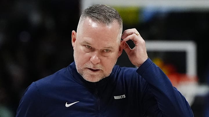 Mar 15, 2025; Denver, Colorado, USA; Denver Nuggets head coach Michael Malone following a timeout in the fourth quarter against the Washington Wizards at Ball Arena. Mandatory Credit: Ron Chenoy-Imagn Images
