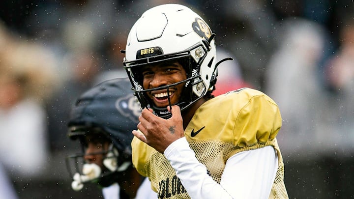 Colorado's Shedeur Sanders smiles before taking a snap during a Colorado football spring game at Folsom Field in Boulder, Colo., on Saturday, April 27, 2024.