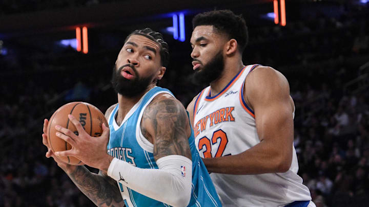 Dec 5, 2024; New York, New York, USA; Charlotte Hornets center Nick Richards (4) posts up against New York Knicks center Karl-Anthony Towns (32) during the first half at Madison Square Garden. Mandatory Credit: John Jones-Imagn Images