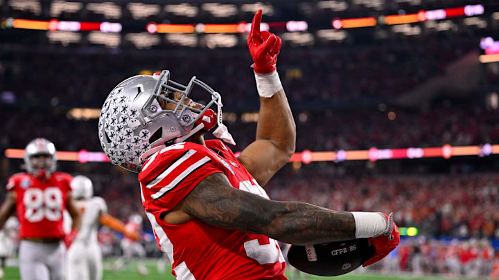 Jan 10, 2025; Arlington, TX, USA; Ohio State Buckeyes running back TreVeyon Henderson (32) celebrates during the game between the Texas Longhorns and the Ohio State Buckeyes at AT&T Stadium. Mandatory Credit: Jerome Miron-Imagn Images