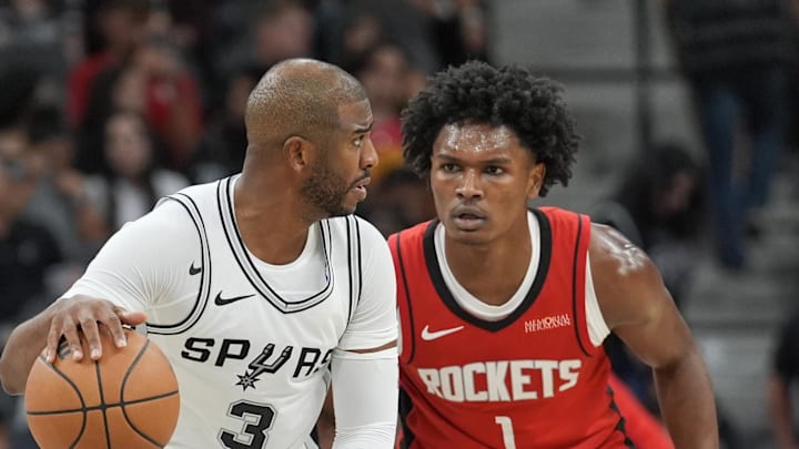 Oct 26, 2024; San Antonio, Texas, USA; San Antonio Spurs guard Chris Paul (3) dribbles against Houston Rockets forward Amen Thompson (1) in the first half at Frost Bank Center. Mandatory Credit: Daniel Dunn-Imagn Images Oct 26, 2024; San Antonio, Texas, USA; San Antonio Spurs guard Chris Paul (3) dribbles against Houston Rockets forward Amen Thompson (1) in the first half at Frost Bank Center. Mandatory Credit: Daniel Dunn-Imagn Images