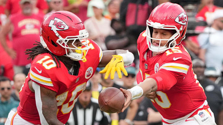 Sep 14, 2025; Kansas City, Missouri, USA; Kansas City Chiefs quarterback Patrick Mahomes (15) hands the ball to running back Isiah Pacheco (10) against the Philadelphia Eagles during the third quarter of the game at GEHA Field at Arrowhead Stadium. Mandatory Credit: Denny Medley-Imagn Images